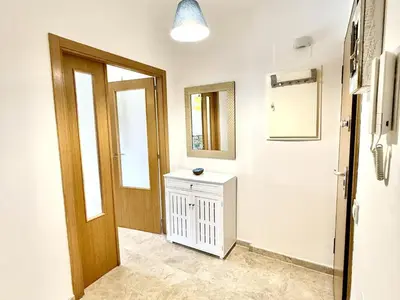 a bathroom with a door and a mirror at Atardecer dorado free parking by staycare in Chipiona