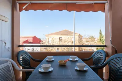 a blue table with cups and saucers on a balcony at aldea 2 5 1ºB in Chiclana de la Frontera