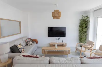 a living room with a couch and a table at GINVA - Apartamento en pleno centro 4 in El Puerto de Santa María