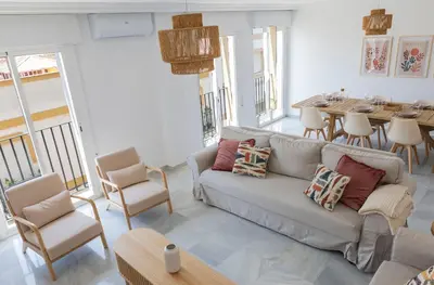 a living room with a couch and a table at GINVA - Apartamento en pleno centro 4 in El Puerto de Santa María