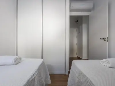 two beds sitting next to each other in a room at Playa Caleta in Cádiz