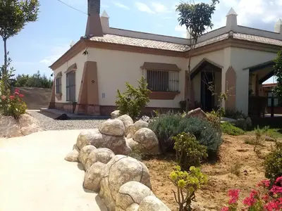 a house with a bunch of rocks in front of it at Casa Bambú de Luna in Chiclana de la Frontera