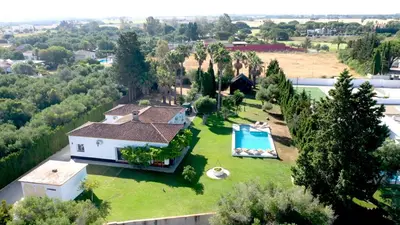 an aerial view of a house with a swimming pool at Jardines Fenicios Luxurious and Spacious Villa in Novo Sancti Petri