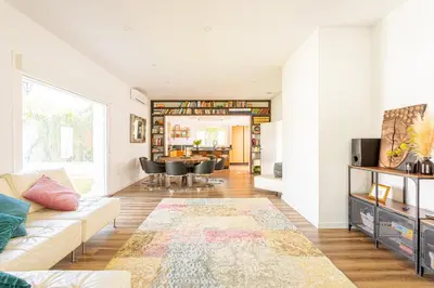a living room with a couch and a table at Jardines Fenicios Luxurious and Spacious Villa in Novo Sancti Petri
