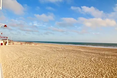 a sandy beach with a view of the ocean at San José Playa Family Home in Cádiz