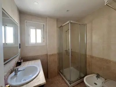 a bathroom with a shower and a sink at Apartamento Luz de Chiclana by Come2Cádiz in Chiclana de la Frontera