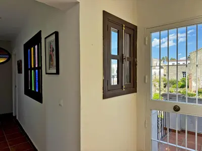 a hallway with a window with a view at Casa Alba de Abades - Ole Solutions in Jerez de la Frontera