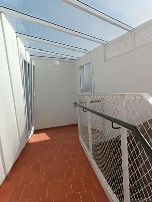 a balcony with a glass roof and a staircase at Apartamento La Bota in Jerez de la Frontera