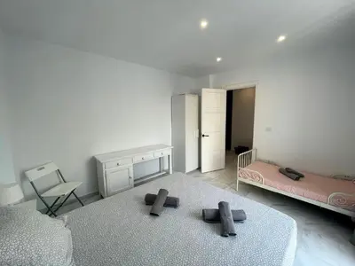 a bedroom with two mattresses on the floor in a room at Apartamento Canalejas in Cádiz