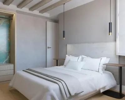 a white bed with white sheets and pillows at Torre Camelia Adults recommended in Cádiz