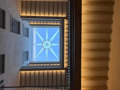 a window in a stairwell with a stained glass window at Torre Camelia Adults recommended in Cádiz