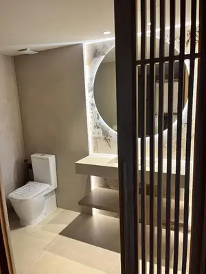a bathroom with a toilet and a sink and a mirror at Torre Camelia Adults recommended in Cádiz