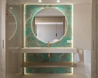 a bathroom with a mirror and a sink at Torre Camelia Adults recommended in Cádiz