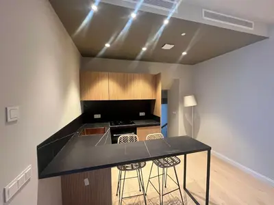 a kitchen with a black counter top in a room at Torre Camelia Adults recommended in Cádiz