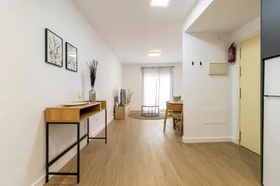 a kitchen with a counter and a desk in a room at Allo Apartments Balderrama Parking Centro 1 Habitación in Jerez de la Frontera