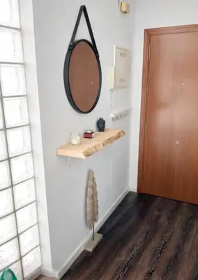 a bedroom with a bed and a closet at Solera y Mar, Apartamentos Living Sur in Sanlúcar de Barrameda