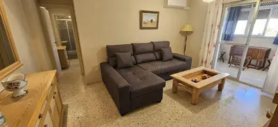 a living room with a couch and a coffee table at Valparaiso Arenas in El Puerto de Santa María