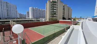 a tennis court on the roof of a building at Valparaiso Arenas in El Puerto de Santa María