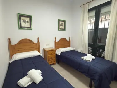 a bedroom with two beds and a window at García Rota Beach by staycare in Rota