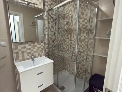 a bathroom with a sink and a shower at García Rota Beach by staycare in Rota
