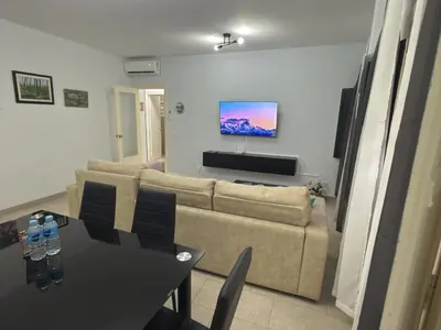 a living room with a couch and a table at García Rota Beach by staycare in Rota
