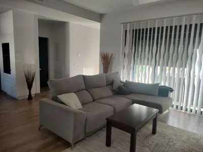 a living room with a couch and a coffee table at Villa Verano in Novo Sancti Petri