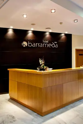 a sign for the front desk of a loan barounter at Hotel Barrameda in Sanlúcar de Barrameda
