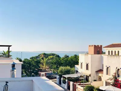 a view of the ocean from the roof of a building at casa jaramar in Sanlúcar de Barrameda