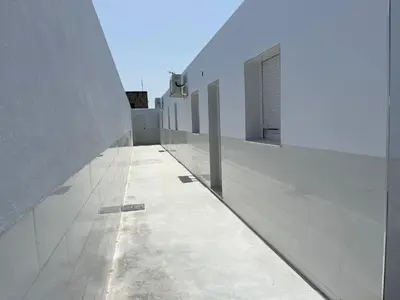 a hallway of a building with white walls at Jaimar12 in Novo Sancti Petri
