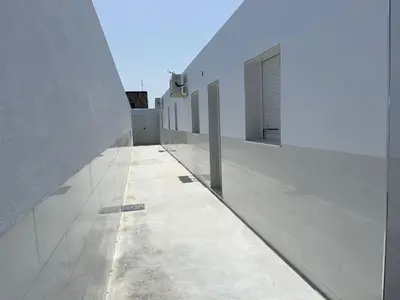 a hallway of a building with white walls at Jaimar12 in Novo Sancti Petri