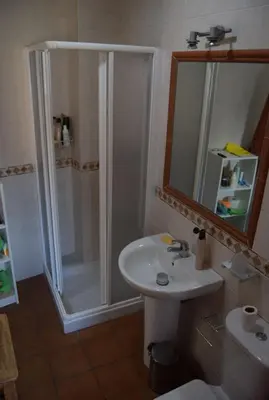 a bathroom with a shower and a sink at Ático Vicario 11 in El Puerto de Santa María
