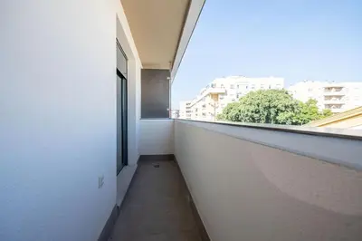 an empty hallway with a window in a building at Centro con piscina y cerca de la estación de tren in El Puerto de Santa María
