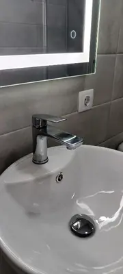 a white sink with a faucet and a mirror at Apartamento Prieta in Jerez de la Frontera
