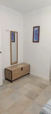 a room with a dresser and a mirror on a wall at Apartamento Prieta in Jerez de la Frontera