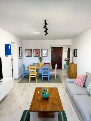 a living room with a couch and a table at Atreb San Fernando in San Fernando