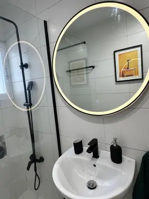 a bathroom with a sink and a mirror at Atreb San Fernando in San Fernando