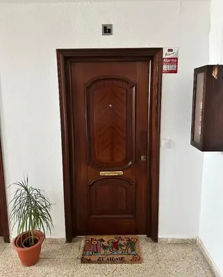 a wooden door with a sign in front of it at Atreb San Fernando in San Fernando