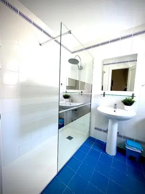 a bathroom with a sink and a glass shower at MyChoice La Forestal in Rota