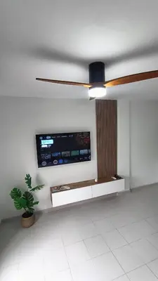 a living room with a couch and a tv at Cosy Apartment Views Pinares Almadraba in Rota