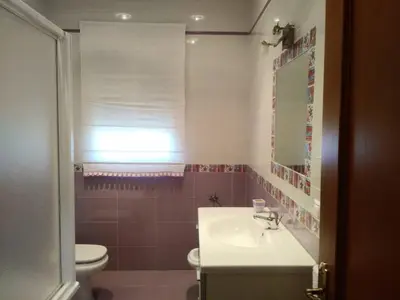 a bathroom with a sink and a toilet at Casa SUROESTE - Zona El Colorado, Conil de la Frontera in Roche