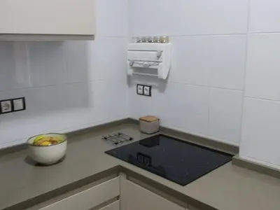 a kitchen with a bowl of fruit on a counter at Cádiz Un respiro en Cádiz in Cádiz