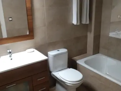 a bathroom with a toilet and a sink and a bath tub at Cádiz Un respiro en Cádiz in Cádiz