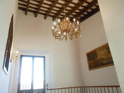 a chandelier hanging from a ceiling in a room at Casa Palacio Morla y Melgarejo in Jerez de la Frontera