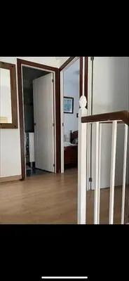 a view of a room with a bed and a mirror at villa los gallos 10 in Chiclana de la Frontera