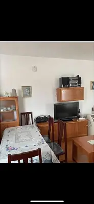 a room with a table and chairs and a dining room at villa los gallos 10 in Chiclana de la Frontera