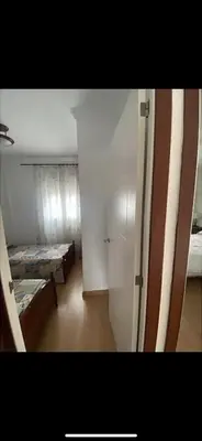 a room with a room with a bed and a door at villa los gallos 10 in Chiclana de la Frontera