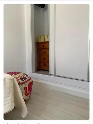 a bedroom with a bed and a large glass window at Villa ELY in Chiclana de la Frontera