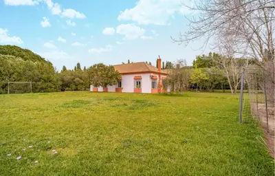 a small house in the middle of a field at Family country house with pool in Conil in Cádiz