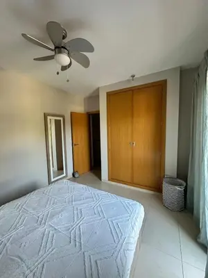 a bedroom with a bed and a ceiling fan at Casa de playa nueva y luminosa in Chiclana de la Frontera