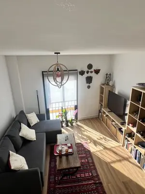 a living room with a couch and a table at GATU Rubí in El Puerto de Santa María
